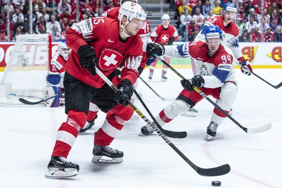Switzerland`s Sven Andrighetto, left, against Czechy`s Radek Faksa during the game between Czech Republic and Switzerland, at the IIHF 2019 World Ice Hockey Championships, at the Ondrej Nepela Arena i ...