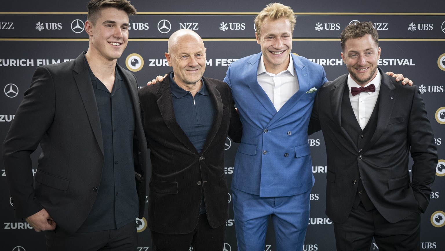 Swiss ski racer Franjo von Allmen, Austrian film producer Gerald Salmina, Swiss ski racer Marco Odermatt and Swiss ski racer Justin Murisier, from left to right, arrive on the Green Carpet at the 21th ...