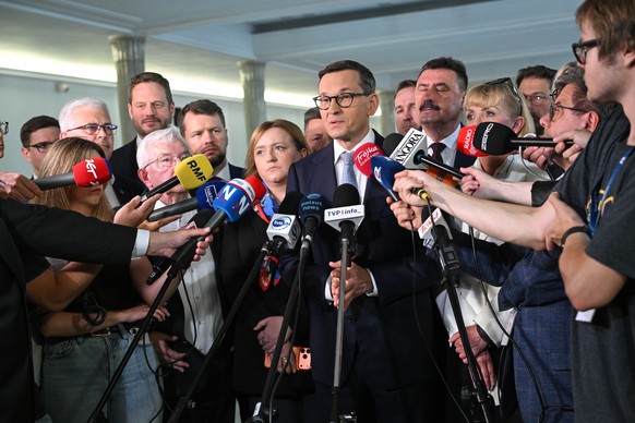 epa13130212 Former Polish Prime Minister Mateusz Morawiecki speaks during a press conference at the Polish parliament building in Warsaw, Poland, 24 July 2026. Morawiecki insisted he sought to maintai ...
