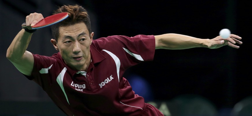 2016 Rio Olympics - Table Tennis - Men&#039;s Singles - Round 2 - Riocentro - Pavilion 3 - Rio de Janeiro, Brazil - 07/08/2016. Li Ping (QAT) of Qatar plays against Adam Pattantyus (HUN) of Hungary. R ...