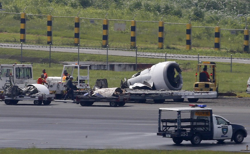 The left engine of Boeing passenger plane from China, a Xiamen Air, sits several meters away on the grassy portion of the runway of the Ninoy Aquino International Airport after it skidded off the runw ...