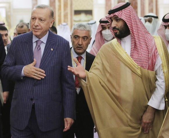 In this photo made available by the Turkish Presidency, Turkish President Recep Tayyip Erdogan, left, and Saudi Arabia&#039;s Crown Prince Mohammed bin Salman speak before a meeting in Jiddah, Saudi A ...