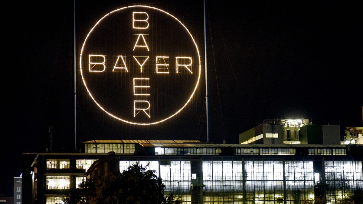 FILE - The Bayer logo shines at night at the main chemical plant of German Bayer AG on Aug. 9, 2019, in Leverkusen, Germany. Bayer CropScience LP and Monsanto Company, who sell top brands of household ...