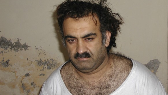 FILE- Khalid Sheikh Mohammed, the alleged Sept. 11 mastermind, is seen shortly after his capture during a raid in Pakistan Saturday March 1, 2003 in this photo obtained by the Associated Press. The ma ...