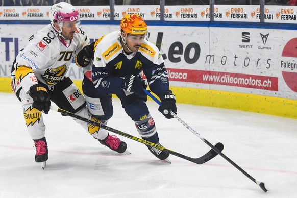 From left Ajoie&#039;s player Matteo Romanenghi and Ambri&#039;s Postfinance Top Scorer Inti Pestoni during the match of National League 2021/22 between HC Ambri Piotta and HC Ajoie at the ice stadium ...