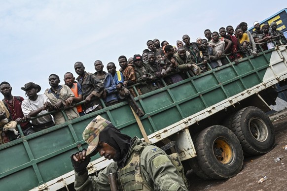 M23 rebels escort government soldiers and police who surrendered to an undisclosed location in Goma, Democratic republic of the Congo, Thursday, Jan. 30, 2025.(AP Photo/Moses Sawasawa)