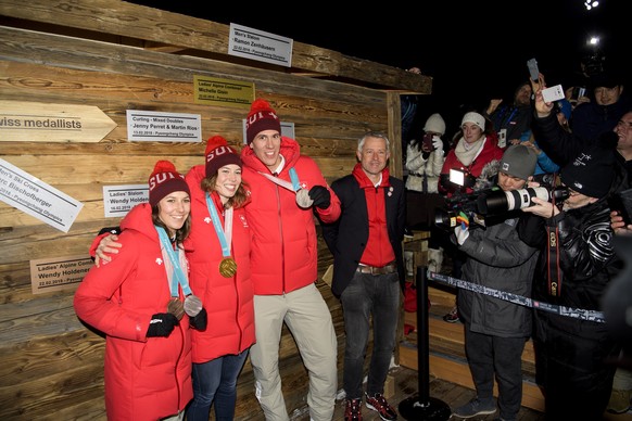 From left to right, Bronze and Silver medals winner Wendy Holdener of Switzerland, Gold medal winner Michelle Gisin of Switzerland, Silver medal winner Ramon Zenhaeusern of Switzerland, and Nicolas Bi ...