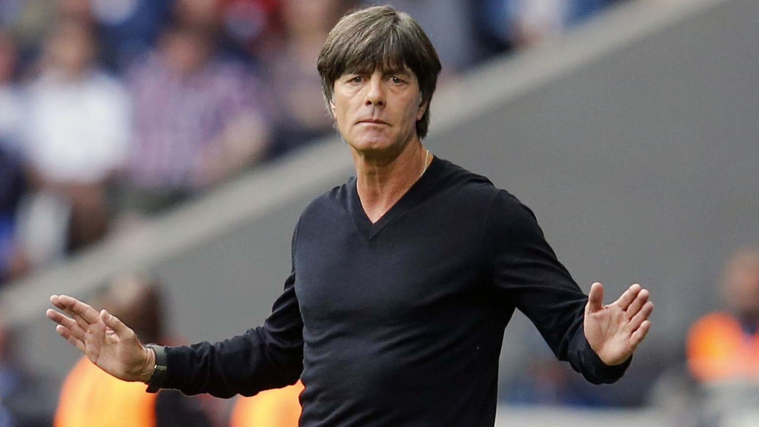 FILE - In this Sunday, June 26, 2016 file photo, Germany coach Joachim Loew gestures during the Euro 2016 round of 16 soccer match between Germany and Slovakia, at the Pierre Mauroy stadium in Villene ...