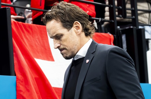Patrick Fischer, head coach of Switzerland national ice hockey team, looks disappointed as they leave his bench after the second period, during the men's group A preliminary round game between Ca ...