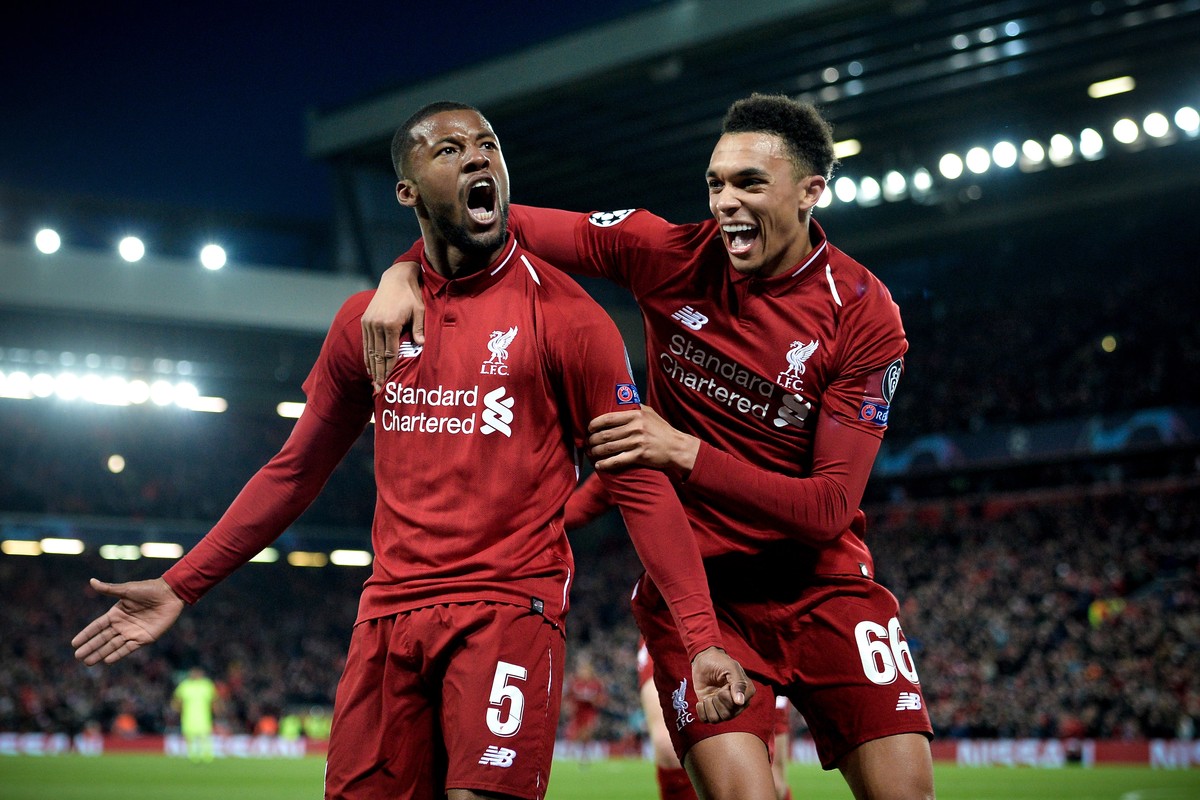 epa07554593 Liverpool's Georginio Wijnaldum (L) celebrates with his teammate Trent Alexander-Arnold (R) after scoring the 3-0 goal during the UEFA Champions League semi final second leg soccer ma ...