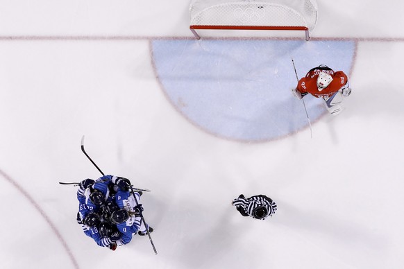 Finland players, top left, celebrate a goal by Michelle Karvinen (33) during the second period of the preliminary round of the men&#039;s hockey game against the Olympic team from Russia at the 2018 W ...