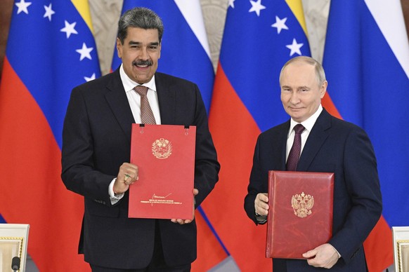 Venezuelan President Nicolas Maduro, left, and Russian President Vladimir Putin attend a signing ceremony after their meeting at the Kremlin in Moscow, Russia, Wednesday, May 7, 2025, ahead of celebra ...