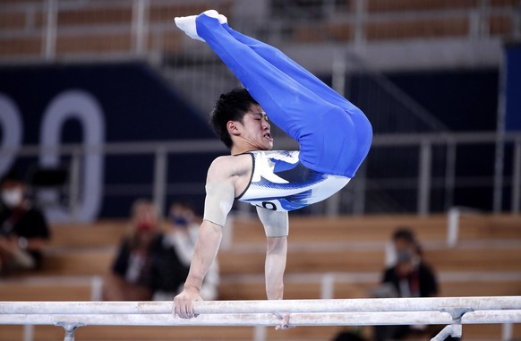 epa09374055 Daiki Hashimoto of Japan competes on the Parallel Bars in the Men&#039;s All-Around Final during the Artistic Gymnastics events of the Tokyo 2020 Olympic Games at the Ariake Gymnastics Cen ...