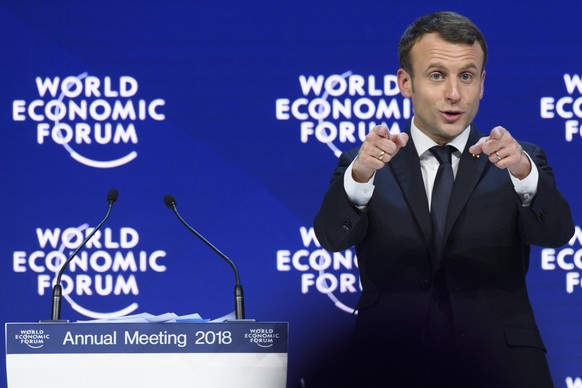 Emmanuel Macron, President of France gestures as he leaves the stage after adressing a plenary session during the 48th Annual Meeting of the World Economic Forum, WEF, in Davos, Switzerland, Wednesday ...