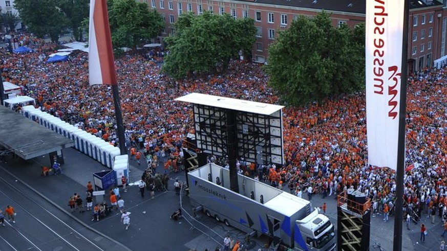 Thousands of soccer fans watch the Euro 2008 European Soccer Championship quarter final match between Holland and Russia in a public viewing zone on the Messeplatz in the city center of Basel, Switzer ...
