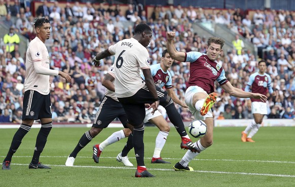 Burnley&#039;s James Tarkowski, right, vies for the ball with Manchester United&#039;s Paul Pogba, during the English Premier League soccer match between Burnley and Manchester United, at Turf Moor, i ...