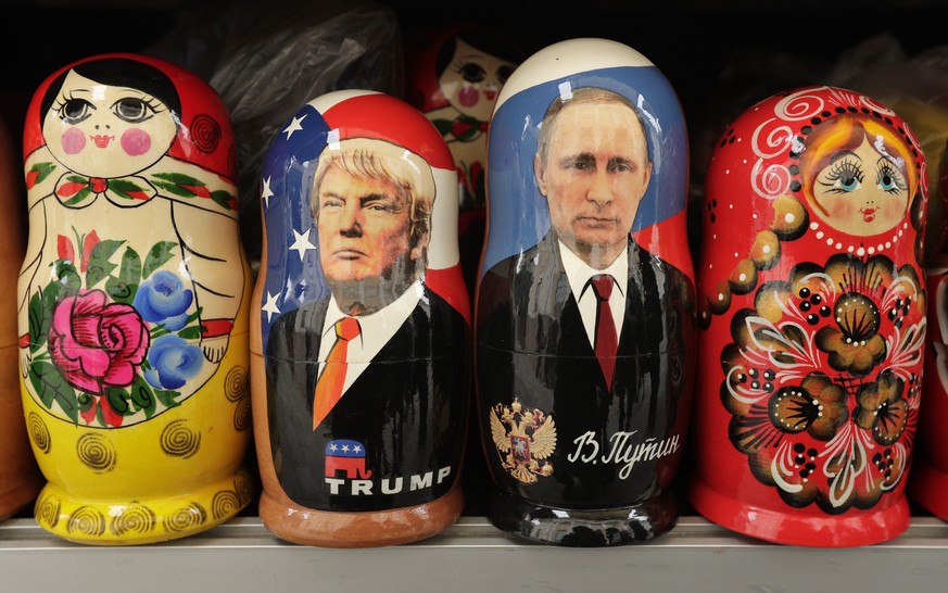 In this Monday, Feb. 20, 2017 traditional Russian wooden dolls called Matryoshka depicting US President Donald Trump, centre left and Russian President Vladimir Putin are displayed for sale at a souve ...