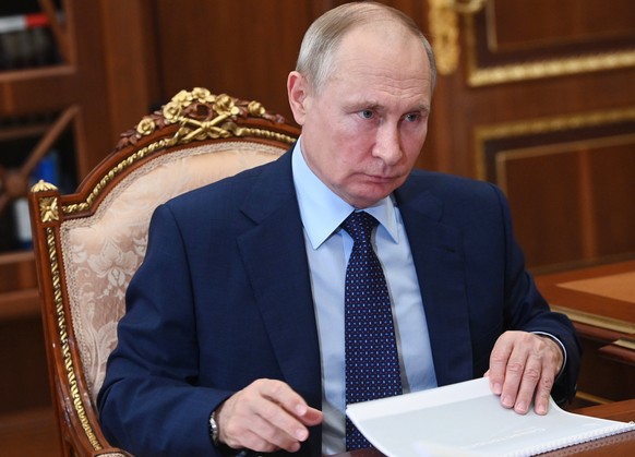 Russian President Vladimir Putin attends a meeting in the Kremlin in Moscow, Russia, Wednesday, Aug. 11, 2021. (Alexei Nikolsky, Sputnik, Kremlin Pool Photo via AP)