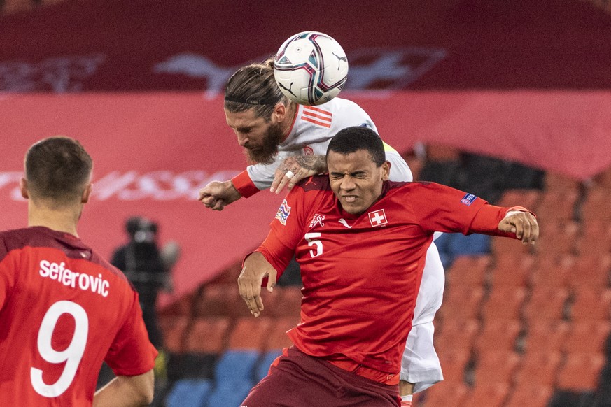 epa08820815 Spain&#039;s Sergio Ramos (up) in action against Switzerland&#039;s Manuel Akanji during the UEFA Nations League soccer match between Switzerland and Spain at St. Jakob-Park stadium in Bas ...