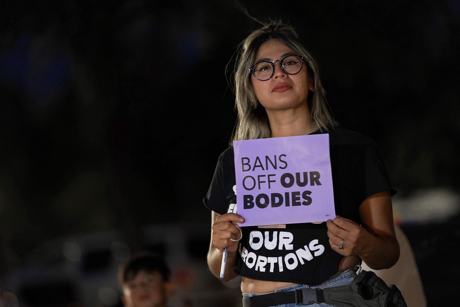 FILE - This file photo shows Celina Washburn at a protest on Sept. 23, 2022, outside the Arizona Capitol in Phoenix to voice her opposition to an abortion ruling. The Arizona Supreme Court ruled Tuesd ...