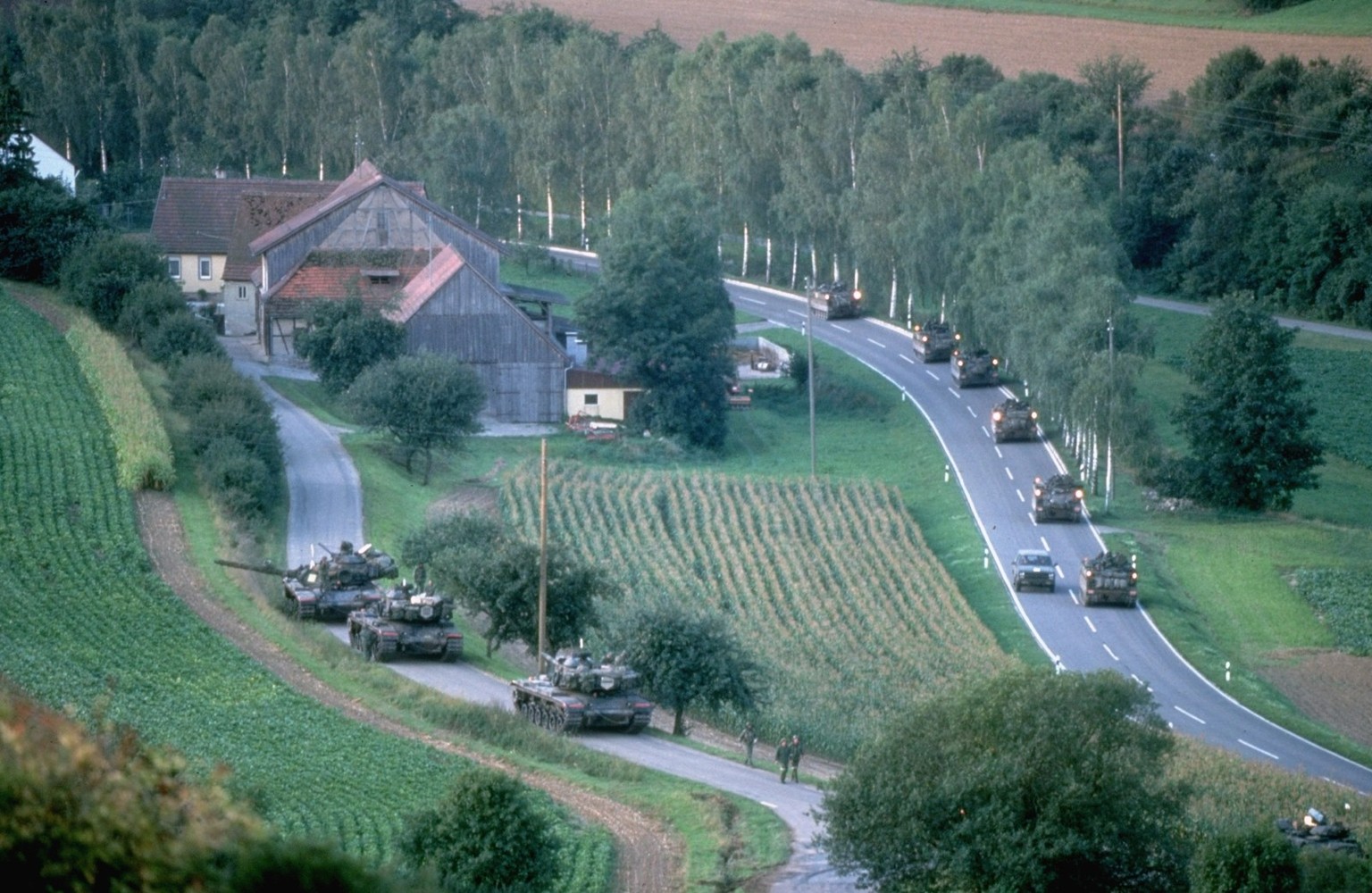 Aerial of US tanks rolling along roads in countryside during NATO Reforger Maneuvers.

Mark Meyer/The LIFE Picture Collection

Special Instructions: Premium. Please contact us for licensing use of thi ...