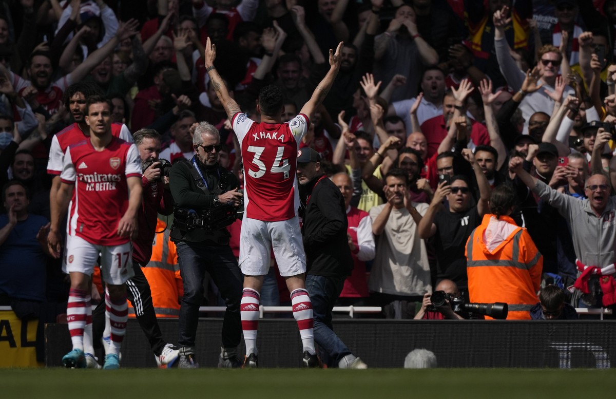 Arsenal's Granit Xhaka celebrates after scoring his side's third goal during an English Premier League soccer match between Arsenal and Manchester United at the Emirates stadium in London, S ...