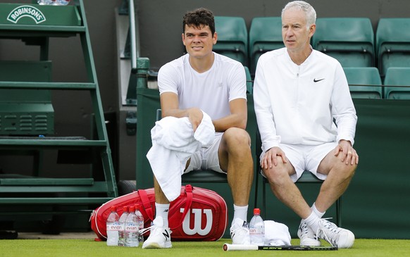 Canada&#039;s Milos Raonic, left, and his coach John McEnroe, at the end of a training session at the All England Lawn Tennis Championships in Wimbledon, London, Wednesday, June 22, 2016. The Wimbledo ...