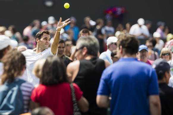 Roger Federer of Switzerland in action during a warm up training session prior to his second round match against Dusan Lajovic of Serbia, at the Wimbledon Championships at the All England Lawn Tennis  ...