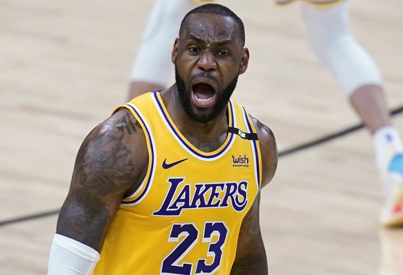 Los Angeles Lakers forward LeBron James celebrates his 3-pointer against the Phoenix Suns during the second half of Game 2 of an NBA basketball first-round playoff series Tuesday, May 25, 2021, in Pho ...