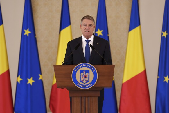 Romanian President Klaus Iohannis nominates Prime Minister designate Marcel Ciolacu, not pictured, to form the new government in Bucharest, Romania, Monday, Dec. 23, 2024. (AP Photo/Vadim Ghirda)