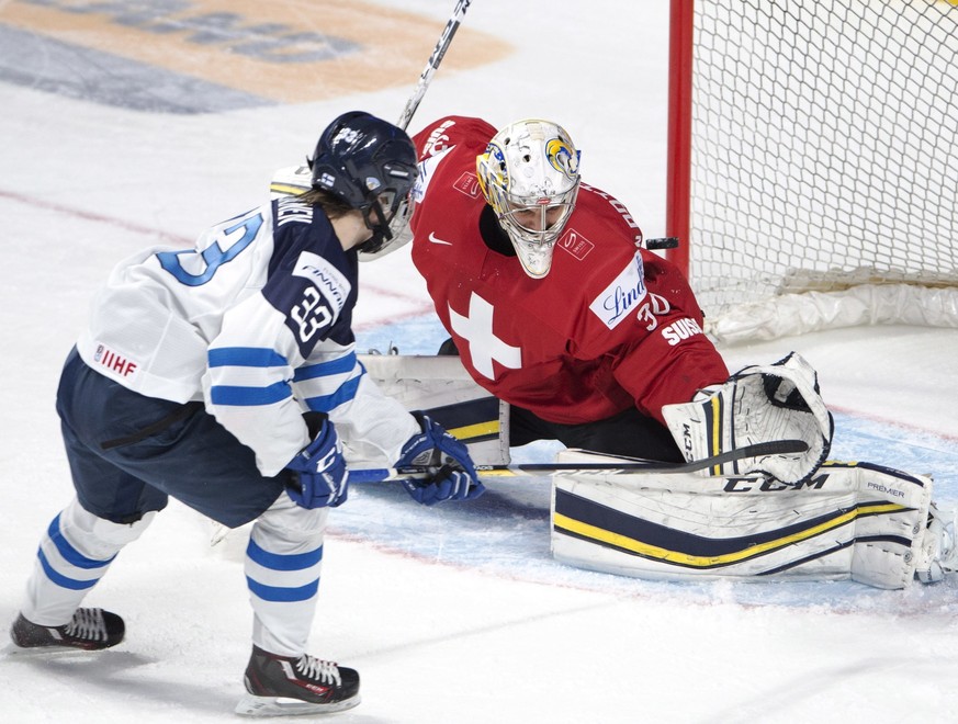 Switzerland goaltender Joren van Pottelberghe (30) makes the save on Finland&#039;s Eeli Tolvanen (33) during the second period of a IIHF World Junior Championships hockey game Saturday, Dec. 31, 2016 ...