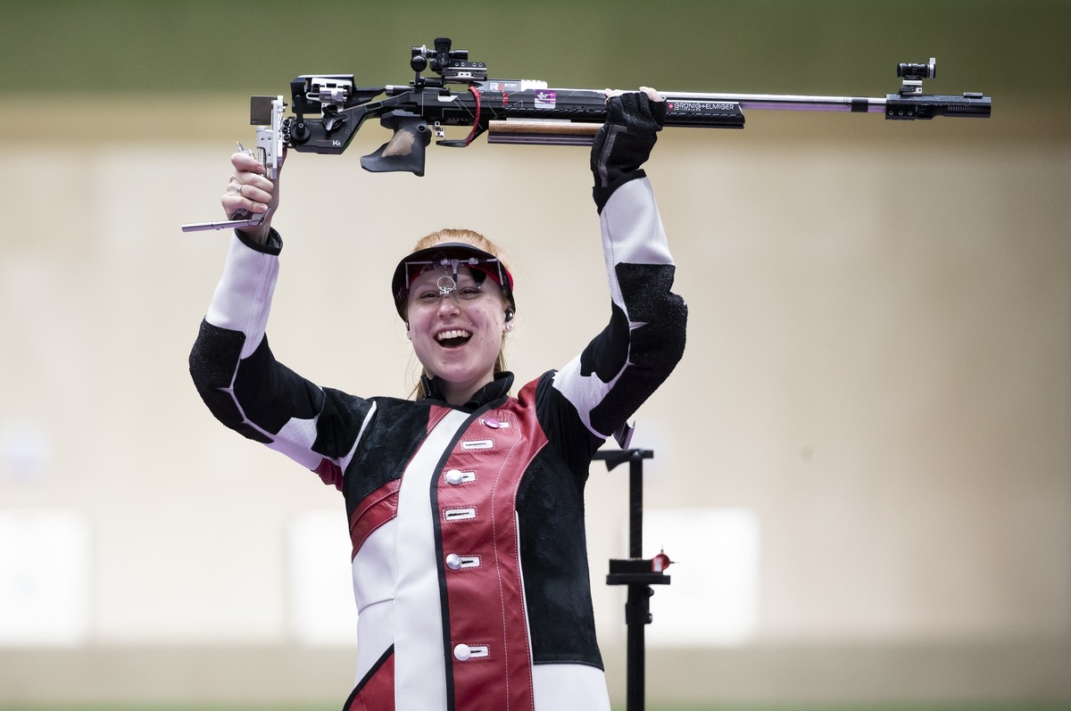 Nina Christen of Switzerland celebrates winning the gold medal in the women's shooting 50m Rifle 3 Positions Finals at the 2020 Tokyo Summer Olympics in Tokyo, Japan, on Saturday, July 31, 2021.  ...