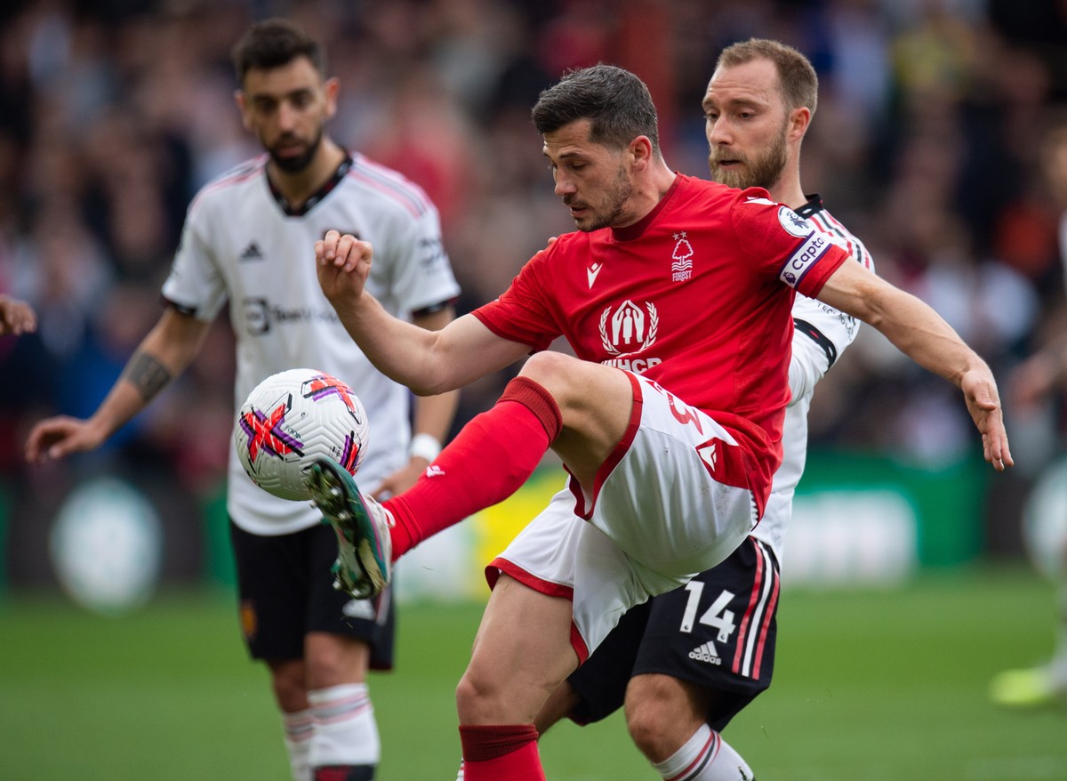 epa10575861 Nottingham Forest's Remo Freuler (L) in action with Manchester United's Christian Eriksen (R) during the English Premier League soccer match between Nottingham Forest and Manches ...