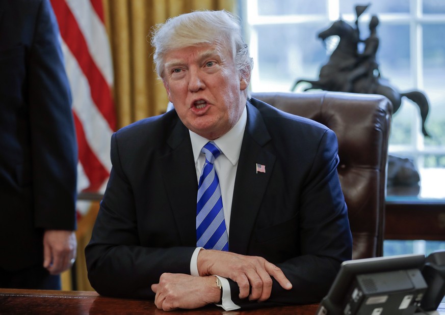 FILE - In this March 24, 2017, file photo President Donald Trump speaksin the Oval Office of the White House in Washington. Trump has been handing out his cellphone number to world leaders and urging  ...