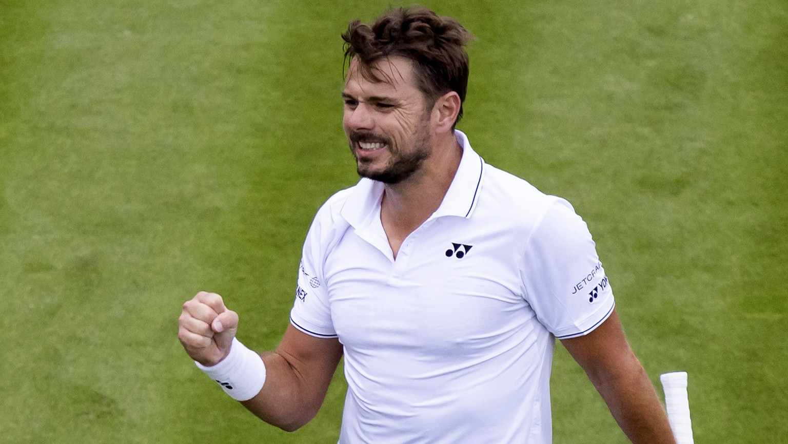 Stan Wawrinka of Switzerland celebrates after winning his first round match against Emil Ruusuvuori of Finland at the All England Lawn Tennis Championships in Wimbledon, London, Monday, July 3, 2023.  ...