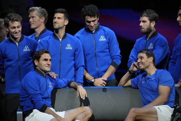 An emotional Roger Federer, left, of Team Europe sits alongside his playing partner Rafael Nadal after their Laver Cup doubles match against Team World&#039;s Jack Sock and Frances Tiafoe at the O2 ar ...