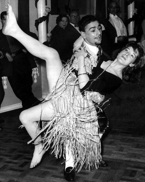 Dancers Barbara O&#039;Brien and Clive Brook in fancy dress at the Chelsea Arts Ball2nd January 1957. (Photo by Day/Daily Mirror/Mirrorpix via Getty Images)