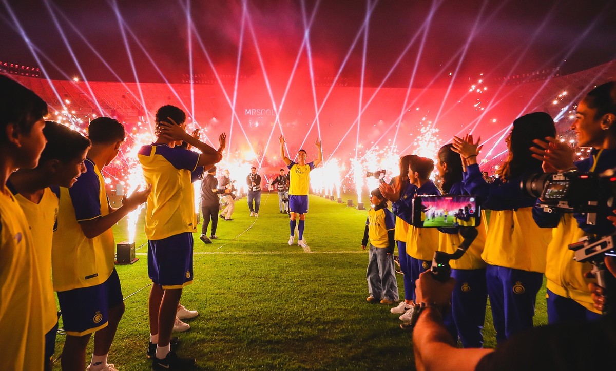 epa10388740 A handout photo made available by the Saudi Al-Nassr Club on 04 January 2023 shows Al-Nassr's new Portuguese forward Cristiano Ronaldo attending a presenting ceremony at Mrsool Park S ...