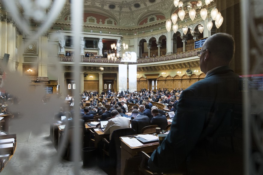 Nationalraete sitzen im Nationalratssaal waehrend der Fruehlingssession der Eidgenoessischen Raete, am Mittwoch, 14. Maerz 2018 in Bern. (KEYSTONE/Peter Klaunzer)