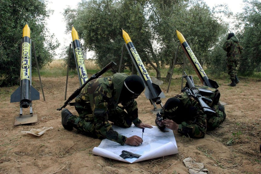A file photograph dated 12 April 2007 shows Palestinian militants from the Islamic Jihad movement in a training exercies where they train fighters on how to launch Kassam rockets into Israel from some ...