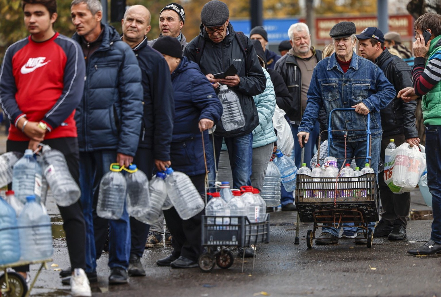 People queue to get drinking water in Mykolaiv, southern Ukraine, on Oct. 23, 2022.
