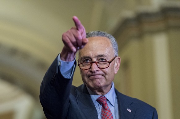 epaselect epa06895337 Senate Minority Leader Chuck Schumer (D-NY), (C), selects the next reporter as he speaks to the media about President Trump&#039;s comments during Monday&#039;s press conference  ...