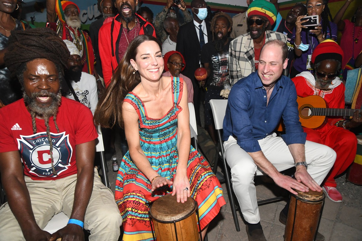 epa09843318 The Duke and Duchess of Cambridge, William and Catherine, play percussion instruments as they visit the 'Cultural Yard' in the Trenchtown neighborhood, where reggae legend Bob Ma ...