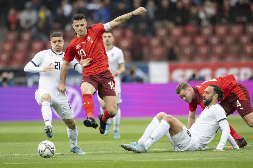 epa09858120 Kosovo&#039;s Blendi Idrizi (L) in action against Switzerland&#039;s Granit Xhaka (C) during the International Friendly soccer match between Switzerland and Kosovo in Zurich, Switzerland,  ...