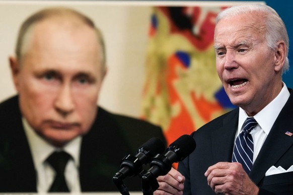 WASHINGTON, DC - JUNE 22: An image of Russian President Vladimir Putin is displayed as U.S. President Joe Biden speaks about gas prices in the South Court Auditorium at the White House campus on June  ...