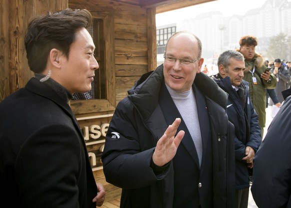 epa06510447 Prince Albert II of Monaco (C) reacts as he visits the House of Switzerland during the PyeongChang 2018 Olympic Games, South Korea, 10 February 2018. EPA/JEAN-CHRISTOPHE BOTT