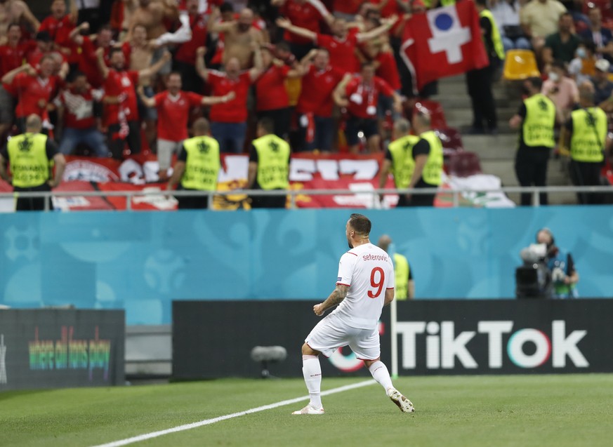 Switzerland&#039;s Haris Seferovic celebrates after scoring his side&#039;s opening goal during the Euro 2020 soccer championship round of 16 match between France and Switzerland at the National Arena ...