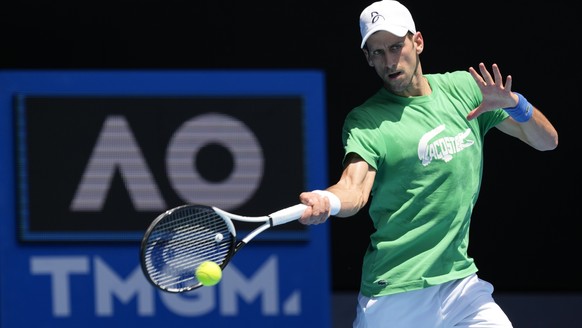 Defending champion Serbian champion Novak Djokovic practices at Margaret Court Arena ahead of the Australian Open tennis championship in Melbourne, Australia, Thursday, January 13, 2022. AP Photo/Mark Bake...