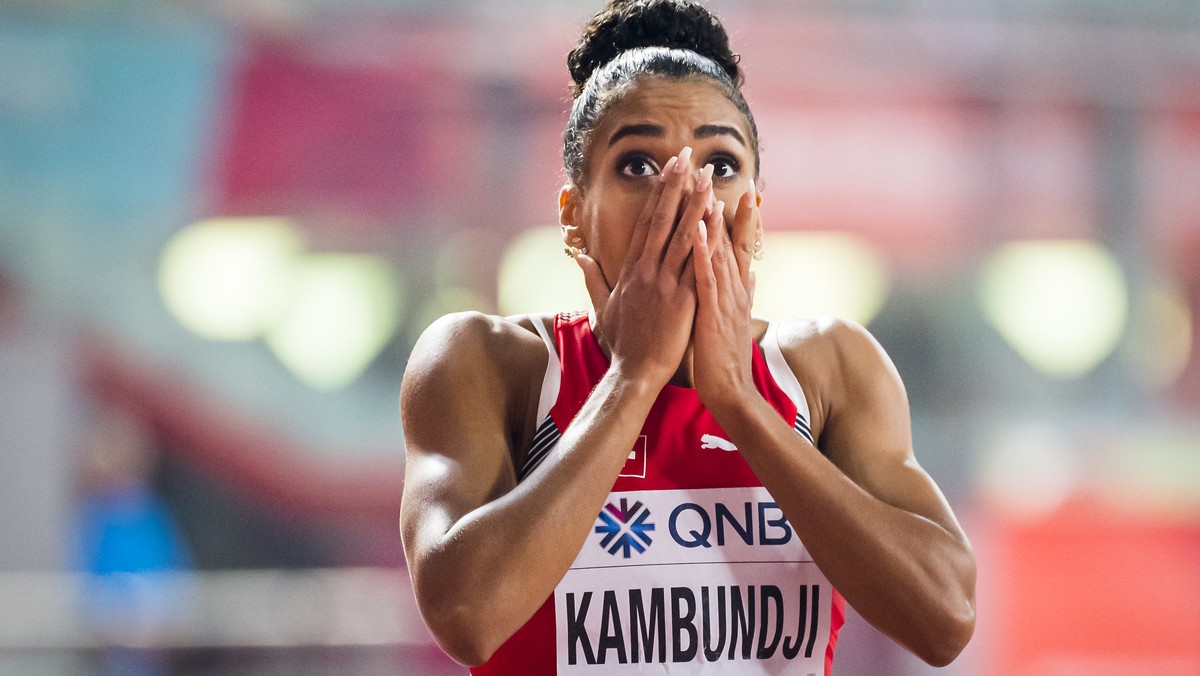 Bronze medal Mujinga Kambundji from Switzerland celebrates during the women's 200 meters final at the IAAF World Athletics Championships, at the Khalifa International Stadium, in Doha, Qatar, Wed ...