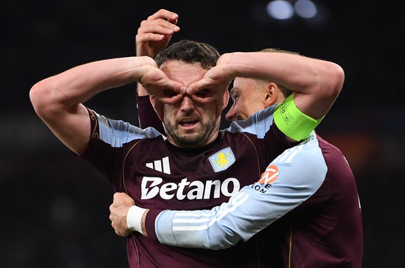 epa12940019 Aston Villa's John McGinn (L) celebrates with Matty Cash (R) after scoring the 4-0 goal during the UEFA Europa League semi-finals 2nd leg match Aston Villa against Nottingham Forest,  ...